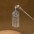Macro shot of silver vintage hair pin featuring hollow flower motif and metal tassels - Silver/F357/Vintage Five Tassel