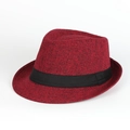 Detail of dark red textured fedora hat with a black band on a clean white background - Burgundy