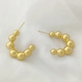 Detailed view of elegant gold-tone U-shaped earrings with round bead chain design - Beaded C-Shape Style (XL1464-51)