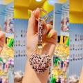 Sparkling heart keychain with colorful crystals and golden ring on a purple strap - Mixed Purple Heart