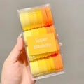 Yellow gradient hair ties set in a clear box featuring high elasticity for girls - Yellow Series 32 Pcs