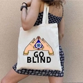 Canvas tote bag in cream white featuring GO BLIND graffiti eye graphic carried on shoulder - STD1804-J GO BLIND Triangle Eye