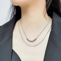 Close-up of double layer silver snake chain necklace with metallic beads on model - Silver Double Layer Seven Beads
