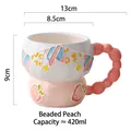 Pink ceramic peach mug with 420ml capacity and unique beaded handle design - Beaded Peach
