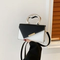 Chic black and white contrast leather handbag with unique liquid silver metal handle - Black