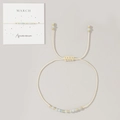 March birthstone bracelet with aquamarine beads and gold accents on cream cord - March-Aquamarine (Card Pack)