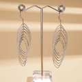 Macro detail of layered marquise-shaped silver earrings on a professional display stand - Earring Hooks / Silver