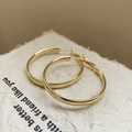 Elegant gold hoop earrings with polished finish on minimal beige background texture - Gold Classic Hoop (71#)