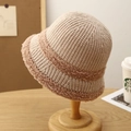 Close-up of beige knitted bucket hat with brown fleece trim on a wooden stand - M (56-58cm) / Beige Khaki Stripe