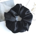 Oversized black satin scrunchie with smooth pleated texture for voluminous hair styles - Black