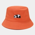 Detail view of the intricate panda embroidery on a bright orange cotton bucket hat - Orange