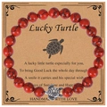 Lucky turtle stretch bracelet with 8mm red marble beads on a brown gift card - Red Howlite