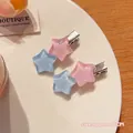 Pink and blue resin star hair clips set with glitter finish on silver metal base - Pink Blue Star Duckbill Clips (Pair)