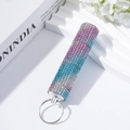 Close-up of three-section diamond-encrusted pill box keychain with colorful rhinestones - Royal Blue