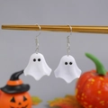 Close-up of ghost earrings made of white resin on gold stand with pumpkins - White (K7248)