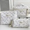 Three-piece quilted makeup bag set with cute colorful cat and floral animal prints - Vibrant Garden