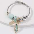 August Harmony beaded bangle with green crystal charms and handmade silver wire design - Green