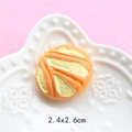 Detailed view of resin miniature bread accessory with orange and yellow stripes 2.4x2.6cm - Round Cheese Bread