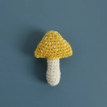Handmade crochet mushroom brooch in yellow and white wool yarn with fine knit texture - Yellow Mushroom Brooch