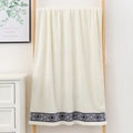 Plush off-white cotton bath towel featuring geometric ethnic embroidery on a wooden ladder - Geometric Ethnic Pattern Hand Towel (Cream White) / 34*74cm