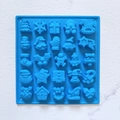 Blue silicone 25-cavity Christmas chocolate mold featuring festive tree and snowflake shapes - Blue