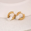 Golden stainless steel hoop earrings featuring a white marbled stone bead - Howlite