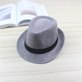 Gray breathable jazz hat with black decorative band on a minimalist wooden background - One Size / Gray