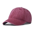 Detail view of burgundy washed cotton fabric and stitching on a short brim baseball cap - Adjustable / Burgundy