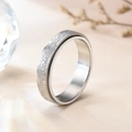 Macro shot of silver spinner ring with a matte frosted texture on a neutral background - US 5 / Silver Sandblasted Spinner Ring