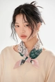 Detail of model wearing a paisley cotton linen scarf in pink and green with gold earrings - Pink and Green Paisley
