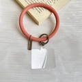 Pink silicone wrist strap for phone case with silver metal ring and PVC tether tab - Sand Pink