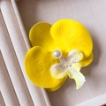 Yellow flower hair clip with a central white pearl on elegant beige fabric - Bright Yellow Orchid Hair Clip