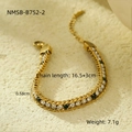 Detailed close-up of golden double-chain bracelet with green gems and white zircons - 18K Gold / White & Dark Green