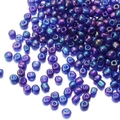 Macro shot of 2mm iridescent seed beads with purple-green metallic luster for jewelry - Iridescent Purple 168