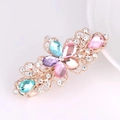 Detail of a floral metal hair clip with colorful pink and blue rhinestones in gold finish - Flower Small (6cm) / Colorful