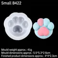 Stampo in silicone a zampa di gatto con campione rosa-blu su sfondo nero per dolci - Zampa di Gatto Piccola / Trasparente