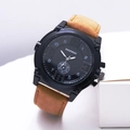 Close-up of men's quartz watch with black dial and brown vintage leather strap - Tan