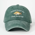 Close-up of Fish Fear Me embroidery on vintage washed green cotton baseball cap - One Size / Dark Green
