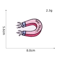 Detail showing embroidered Babe Magnet patch with clear dimensions 8.0cm x 5.6cm - Pink Magnet