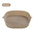 Brown silicone air fryer basket liner with raised edges and heat-resistant handles - Brown