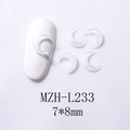 Macro detail of 7x8mm moon-shaped nail art charms made of clear resin for manicure - White Moon Style (L233)