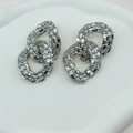 Macro detail of silver oversized chain link earrings with micro-paved crystal rhinestones - Silver Chain