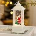 Detalle macro del farol de Navidad con figura de Papá Noel y efecto de agua brillante - Papá Noel blanco