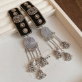 Close-up of velvet ethnic bell tassels with rhinestone accents on a jewelry tray - No.36 BB Clip - Black & Silver - Round - Single Piece