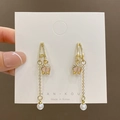 Elegant gold tulip earrings featuring long tassels, delicate rhinestones, and white pearls - Long Tulip Pearl Tassel / Gold