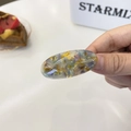 Detail view of oval acetate hair clip with marble texture and golden handmade lettering - Approx. 5cm / Transparent Greenish Yellow