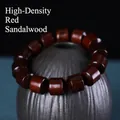 Macro shot of high-density sandalwood cylinder beads with deep reddish-brown texture - Pterocarpus Tinctorius Barrel Beads / 15mm x 14 Pieces / Reddish Brown