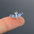 Silver dragonfly stud piercing with blue marquise zircon crystals on a fingertip - CC088-1 Silver Colorful Dragonfly