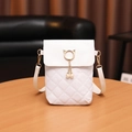 White quilted crossbody bag featuring gold cat ear ring and pearl tassel decoration - White