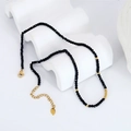 Handmade beaded necklace featuring faceted black rhinestones and small gold accent beads - Black
